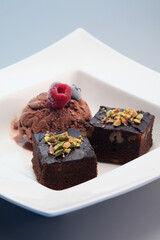 Brownies served with chocolate ice cream
