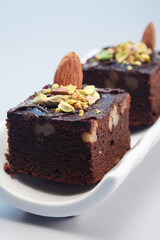 Brownie with almond and pistachio nut toppings