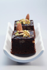 Brownie with almond and pistachio nut toppings