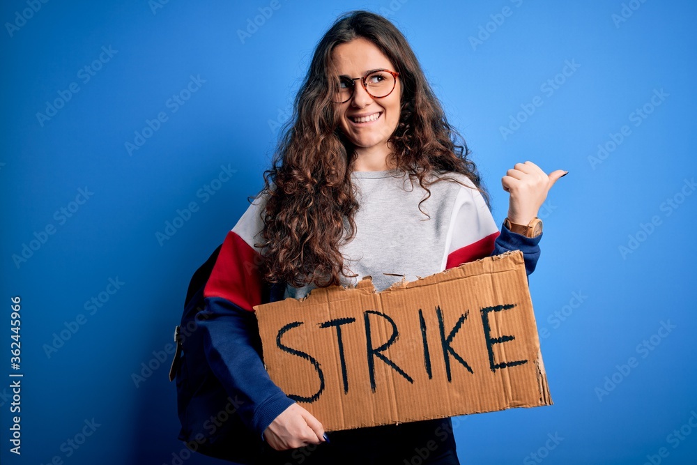 Sticker beautiful student woman with curly hair wearing backpack holding banner with strike message pointing