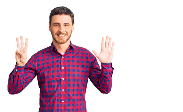 Handsome young man with bear wearing casual shirt showing and pointing up with fingers number eight while smiling confident and happy.