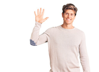 Naklejka premium Young handsome man wearing casual clothes showing and pointing up with fingers number five while smiling confident and happy.