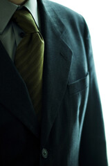 Close-up of a blue coat with striped tie