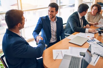 Business lawyers workers meeting at law firm office. Professional executive partners working on finance strategry at the workplace. Shaking hands for succesful agreement.