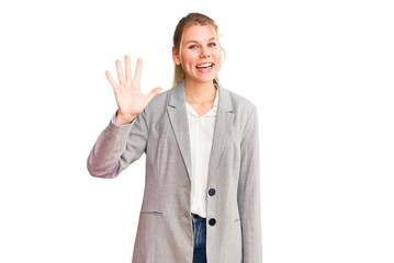 Young beautiful blonde woman wearing elegant jacket showing and pointing up with fingers number five while smiling confident and happy.