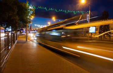 Fototapeta na wymiar Motion blurred bus overpass in the evening.