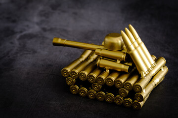bullet shell toy tank on a black background closeup view