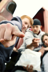 Three boys sharing a packet of french fries