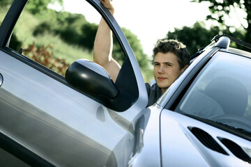 Boy sitting in a car