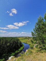 Obraz premium landscape with blue sky and clouds. Natural reserve in Sverdlovsk region, Russia. Manturov kamen, stone and rocks on river coast