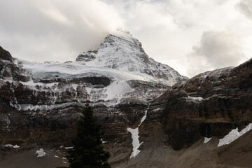Fototapeta premium super high snowy peak in the mountains in autumn