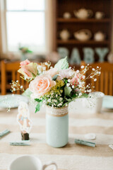 Pink Roses on a Dining Room Table