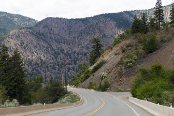 Road in the mountains in summer with hills