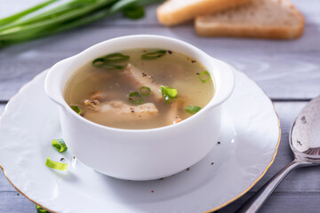 Fresh fish soup with ingredients and spices for cooking. Woodn background