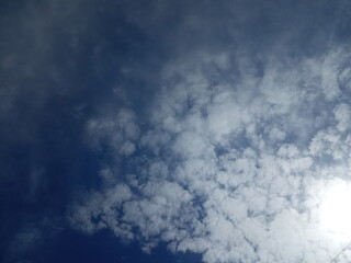 Clouds with dark blue sky background