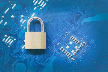 Master key or Gold Padlock on electronic motherboards background.