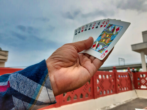 Picture of a person playing cards