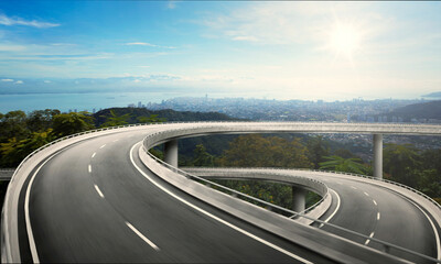 Highway overpass motion blur with nature mountain background during sunrise.