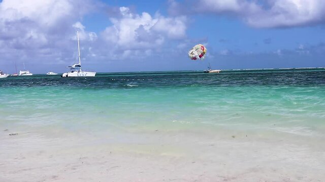 Parasail on the Caribbean water with a boat.  Beautiful turquoise water.