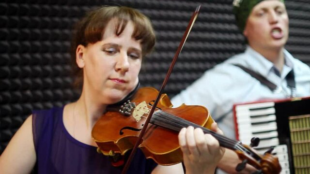 a woman plays the violin
