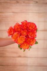 Close up of a bouquet of Free Spirit roses variety, studio shot, orange flowers