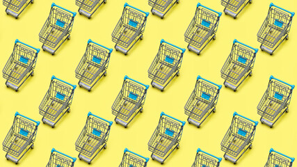 Metal shopping cart (toy), cloned, propagated on yellow background. Background pattern.