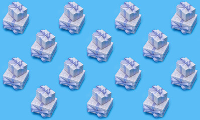 Background pattern. Happy holidays. Gift boxes with patterns, multiplied, cloned on blue background.