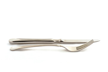 Fork and knife against a white background