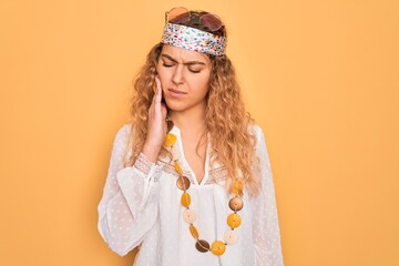 Young beautiful blonde hippie woman with blue eyes wearing sunglasses and accessories touching mouth with hand with painful expression because of toothache or dental illness on teeth. Dentist