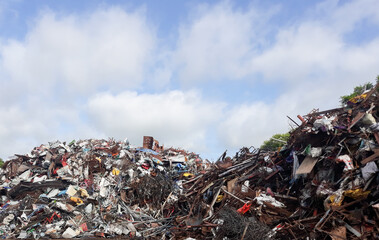 A pile of scrap metal and many antiques in an antique store