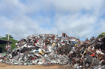 A pile of scrap metal and many antiques in an antique store
