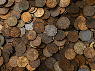 Background of old coins in low key. Old Russian coins, rubles and pennies.