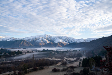 Panorama of Snow Mountain Range Landscape with Blue Sky background from New Zealand.