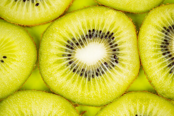 Close up of fresh slices of kiwi fruit on table