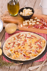 Tart with fried potato, raclette cheese and smoke flavour bacon.

