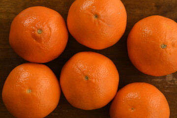 Mandarin orange fruits on wooden background