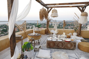 boho rooftop picnic at sunrise