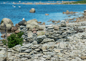 beautiful white stone piles by the sea, these objects were built by travelers, Saaremaa Island, Estonia