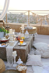 boho rooftop picnic at sunrise