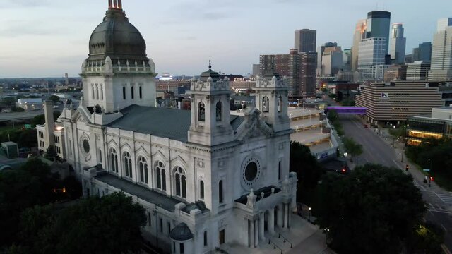 aerial view of st mary chatedral in downtown minneapolis, skyline buildings in the background during blue hour