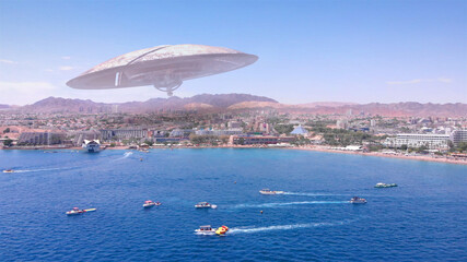 Alien ufo Saucers over Large Vacation City desert near sea,Aerial
Red sea, Eilat city, Israel Drone view with visual effect Elements, summer
