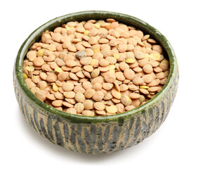 Raw lentils in bowl on white background