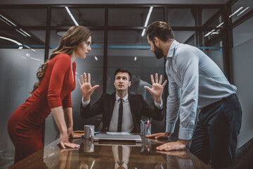 Lawyer trying to stop the argument between spouses