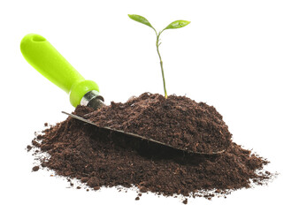 Soil, plant and shovel on white background