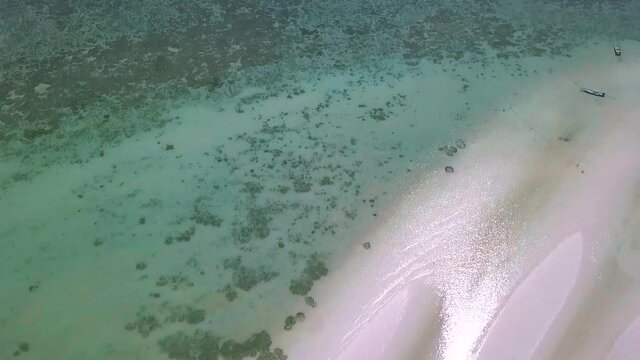 Aerial drone panoramic view at the low tide. Long Sandy beach and palm trees. Exploring Thailand