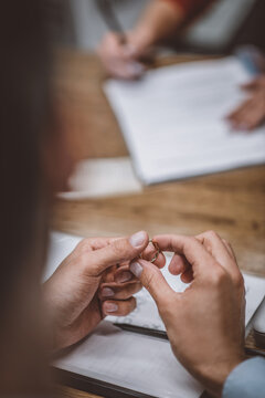 Woman holding his wedding ring after getting divorced