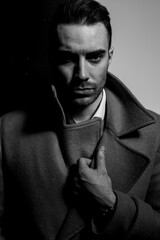 sexy young fashion model holding hand on collar