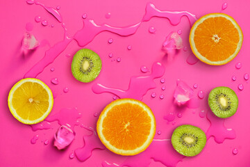 Fresh juicy slices of orange, kiwi fruit and lemon on bright red background covered with water drops