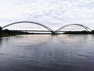 Fototapeta na wymiar View of the road bridge in Torun on the Vistula River.
