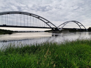 Naklejka premium View of the road bridge in Torun on the Vistula River.